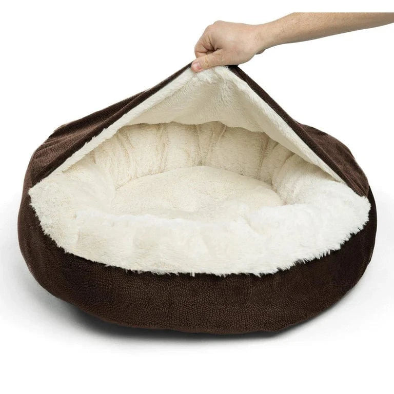 Demonstrating the flexible hood and covered structure of the brown cozy cave dog bed