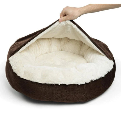 Demonstrating the flexible hood and covered structure of the brown cozy cave dog bed