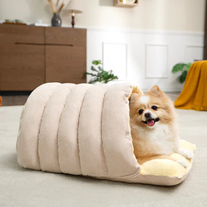 A small dog relaxing in the beige Dogegis™ anti-anxiety cave bed for restorative sleep