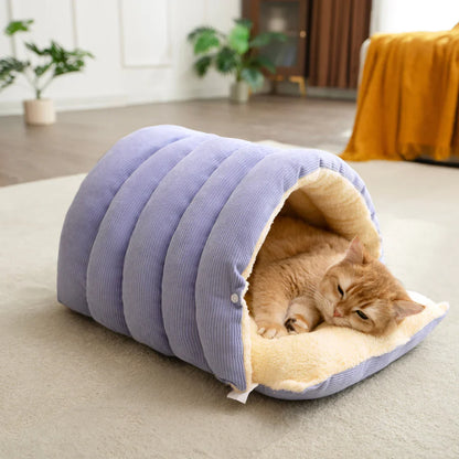 A cat resting inside the purple Dogegis™ 2-in-1 Calming Cave bed in Cave Mode for secure anxiety relief