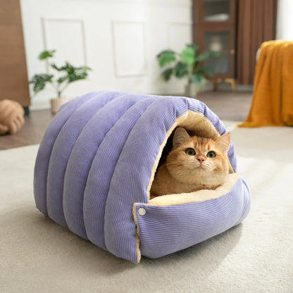 Close-up of a cat inside the purple Dogegis™ self-warming calming cave bed