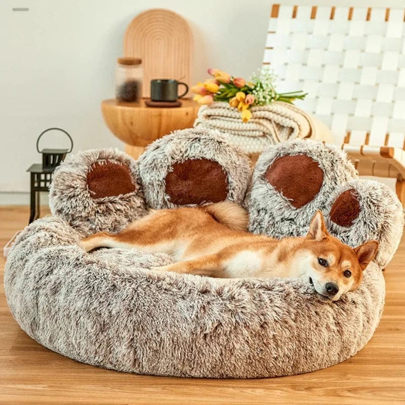 A Shiba Inu resting peacefully on the brown paw-shaped Dogegis™ anxiety-relief dog bed.