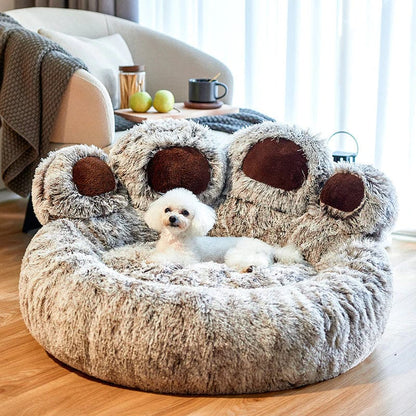 A small dog resting inside the grey paw-shaped Dogegis™ calming dog bed for anxiety relief.