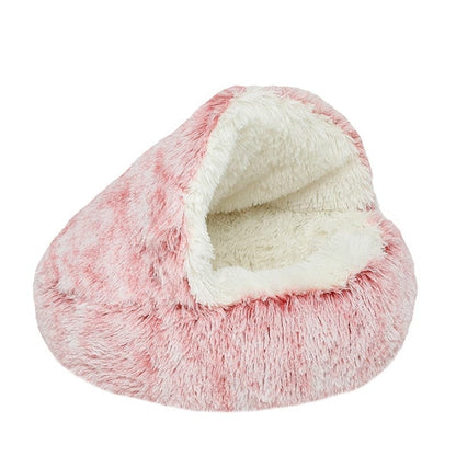 Pink plush Dogegis® CozyNook hooded dog bed providing a soft, comforting embrace for pets